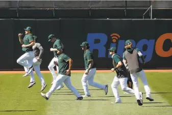  ?? Lea Suzuki / The Chronicle ?? A’s players know the team has to come out of the gate fast and buck their recent tendency of posting losing records in the early part of the season in order to contend over 60 games.