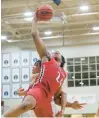  ?? TROY STOLT/DAILY SOUTHTOWN ?? Marist’s Achilles Anderson grabs a rebound against Joliet Catholic on Thursday.