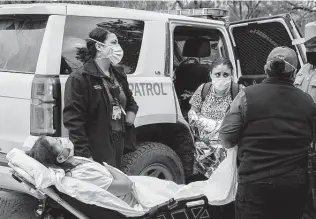  ??  ?? Venezuelan Belkis Salas is put on a stretcher after her difficult crossing April 30.