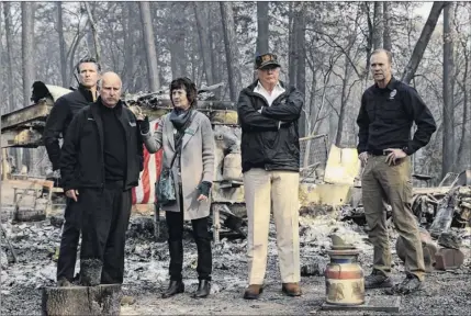  ?? Photos by Evan Vucci / Associated Press ?? President Donald Trump talks with Gov.-elect Gavin Newsom, left, California Gov. Jerry Brown, Paradise Mayor Jody Jones and FEMA Administra­tor Brock Long on Saturday at a neighborho­od destroyed by the wildfires.