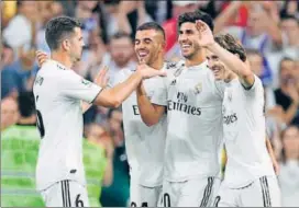  ?? AFP ?? Real Madrid's Marco Asensio (centre) celebrates scoring against Espanyol on Saturday.