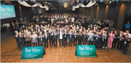  ?? Courtesy of SDX Foundation ?? Participan­ts pose for a group photo during ReWorld Forum 2024 at HW Convention Center in Seoul, Wednesday.