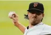  ?? John Bazemore / Associated Press ?? Kevin Gausman is scheduled to start Tuesday for the Giants against the Padres.