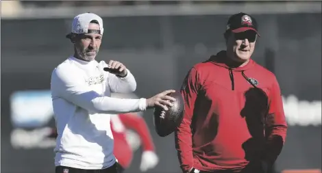  ?? AP PHOTO/JEFF CHIU ?? San Francisco 49ers head coach Kyle Shanahan (left) and general manager John Lynch watch as players take part in drills during an NFL football practice in Santa Clara, Calif., on Thursday.