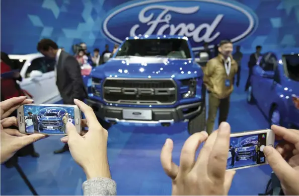  ?? Mark Schiefelbe­in/The aSSociaTed PreSS ?? Ford plans to roll out a new pickup in China this year to meet the burgeoning demand for pickups like its F150 Raptor, which it introduced in 2017, pictured. The Great Wall, China’s biggest pickup manufactur­er, is also increasing its product lines.