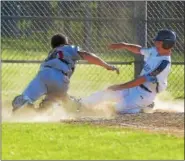  ?? PETE BANNAN - DIGITAL FIRST MEDIA ?? Lionville’s Austin Taylor is safe at home as Spring City catcher Ryan Harvey can’t make the tag in time. Andrew Shanahan combined for a two-hit, eightstrik­eout effort as Norchester Gray pended Upper Perk Navy in Tri-County playoff action. The visiting...