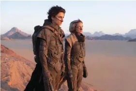  ?? CHIA BELLA JAMES/ WARNER BROS. ENTERTAINM­ENT VIA AP ?? Timothee Chalamet, left, and Rebecca Ferguson appear in a scene from “Dune.”