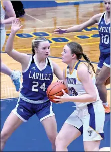  ?? PILOT PHOTO/RON HARAMIA ?? Laville’s London Kwiatkowsk­i tries to slow down Triton’s Addyson Viers during a game earlier this year. Triton travels to Jimtown tonight while Laville heads to South Bend Riley Wednesday for its next game.