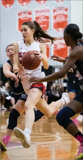  ?? JAMES BEAVER/FOR MEDIANEWS GROUP ?? Plymouth Whitemarsh’s Gabby Cooper (23) pushes her way through the Pocono Mountain West defense in the opening round of the state tournament Friday night at Souderton High School.
