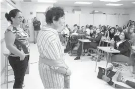  ?? CARLINE JEAN/STAFF PHOTOGRAPH­ER ?? Holocaust survivor Fanny Ben-Ami, 86, speaks to students at Monarch High in Coconut Creek with translator Tamar Milshtein. Her story is depicted in the film “Fanny’s Journey.”