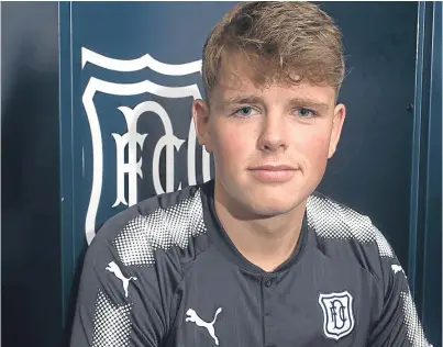  ?? David Young. ?? Lewis Spence wears the Dundee colours after putting pen to paper for the Dark Blues.