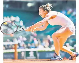  ??  ?? Romania’s Simona Halep returns the ball to Spain’s Carla Suarez Navarro during their tennis match at the Roland Garros 2017 French Open in Paris. — AFP photo