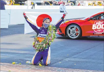  ?? Michael Conroy The Associated Press ?? Takuma Sato celebrates Sunday after winning the Indianapol­is 500. It was a disappoint­ing finish because it came under a caution after a wreck happened with five laps to go. It was the second time Sato has won this race.