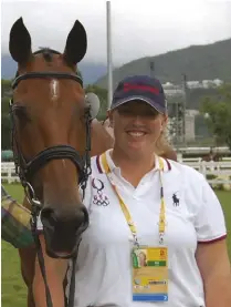  ??  ?? Emma Ford has been grooming for Phillip Dutton since 2005, traveling to multiple Olympic and World Equestrian Games. (She is pictured here at the Beijing Olympics.)