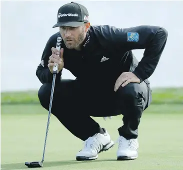  ?? — GETTY IMAGES ?? Dustin Johnson lines up his putt on the 18th green during the third round of the ATVT Pebble Beach National Pro-Am on Saturday.