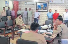  ??  ?? IG A Satish Ganesh at the district police office on Tuesday. While penalising errant staff, he ordered that those who had arrived at work on time be rewarded for their punctualit­y. (Below) At the record room.