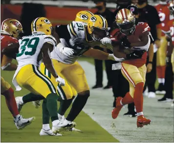  ?? NHAT V. MEYER — STAFF PHOTOGRAPH­ER ?? The 49ers’ JaMycal Hasty is forced out of bounds by the Packers in the second quarter Thursday at Levi’s Stadium.