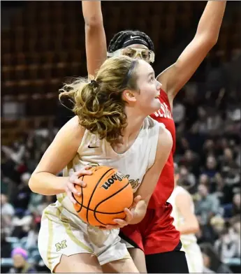  ?? ALISSA NOE — BOCOPREPS.COM ?? Monarch’s Amelia Rosin drives to the basket around Regis Jesuit’s Hana Belibi on Saturday morning at the Denver Coliseum.