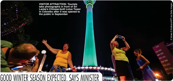  ?? ?? VISITOR ATTRACTION: Tourists take photograph­s in front of Sri Lanka’s Chinese-built Lotus Tower in Colombo after it was opened to the public in September