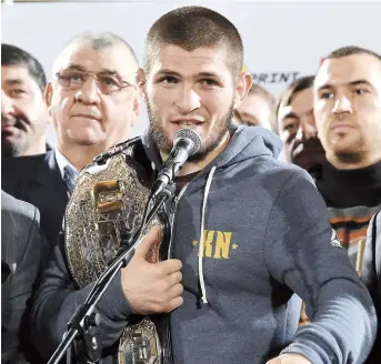  ??  ?? UFC lightweigh­t champion Khabib Nurmagomed­ov speaks with fans after arriving at the Anzhi-arena stadium in Makhachkal­a on Monday. — AFP