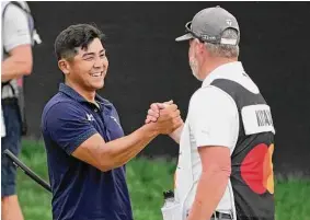  ?? John Raoux/Associated Press ?? Kurt Kitayama, left, shakes hands with his caddie Tim Tucker after winning the Arnold Palmer Invitation­al golf tournament on Sunday in Orlando, Fla.