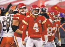  ?? Charlie Riedel / Associated Press ?? Chad Henne celebrates a 13yard run on 3rdand14. His 5yard pass to Tyreek Hill then allowed K.C. to run out the clock.