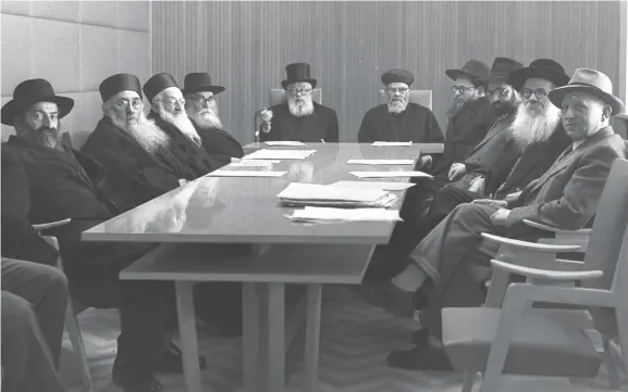  ?? (Wikimedia Commons) ?? ISRAEL’S CHIEF Rabbinate Council, 1959. At its helm sit Ashkenazi chief Rabbi Yitzhak HaLevi Herzog (center, at left) and Sephardi chief Rabbi Yitzhak Nissim (at right).