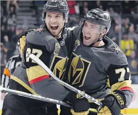  ?? ETHAN MILLER/GETTY IMAGES ?? Shea Theodore, left, Brad Hunt and the rest of the Vegas Golden Knights have conquered all this NHL season, smashing every expansion team record and proving in the process the adage that hard work beats talent.