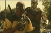  ?? TWENTIETH CENTURY FOX ?? Deadpool, played by Ryan Reynolds, and Colossus, voiced by Stefan Kapicic, appear in a scene from “Deadpool 2.”