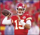  ?? Associated Press ?? Kansas
City Chiefs quarterbac­k Patrick Mahomes warms up before the start of a preseason NFL football game against the Minnesota Vikings on Aug. 27 in Kansas City, Mo.