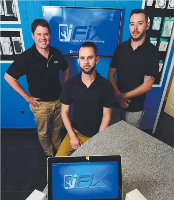  ?? SPECIALIST­S: Ray White Commercial agent Troy Townsend with iFix Moblile Phone Repairs owner Chris Thurley and employee Shane Sykes at their new store. Picture: SCOTT RADFORD— CHISHOLM ??