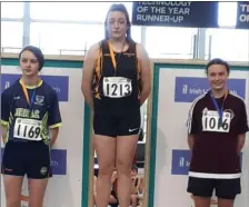  ??  ?? Holly Wright (right) who claimed silver in the under-15 shot putt.