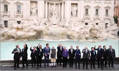  ?? GREGORIO BORGIA / AP ?? Leaders of the G20 pose in front of the Trevi Fountain during an event for the G20 summit in Rome on Sunday. The two-day Group of 20 summit has concluded, the first in-person gathering of leaders of the world’s biggest economies since the COVID-19 pandemic started.