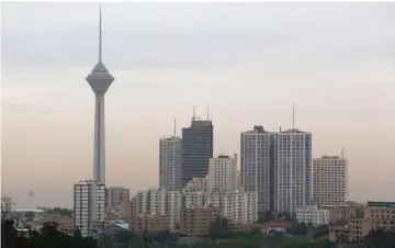  ??  ?? A view of the Iranian capital Tehran and its Milad Tower on May 9. A senior Iranian central bank official said conditions within the banking system had deteriorat­ed in the past year, and “we have still not passed the danger zone” but added that the...