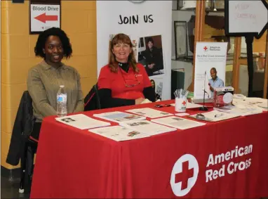  ?? MICHILEA PATTERSON — FOR MEDIANEWS GROUP ?? Rose van Hulst, on the left, and Mary Noll, on the left, are volunteers with the American Red Cross and sit at an informatio­n table during a combined blood drive and wellness fair at Montgomery County Community College in Pottstown.