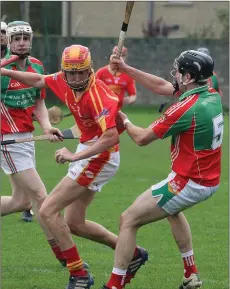 ??  ?? David O’Shea of Horeswood is tackled by Peter O’Sullivan (Rapparees) in the Permanent TSB Junior hurling semi-final replay on Saturday.