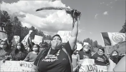  ?? The Associated Press ?? Native American protesters shout ahead of a speech by President Donald Trump, Friday, in South Dakota.