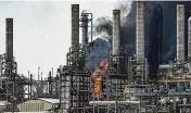  ?? ASSOCIATED PRESS ?? A chemical plant in the Houston area caught fire Friday, producing a huge plume of smoke and sending nine to the hospital. There were no fatalities.