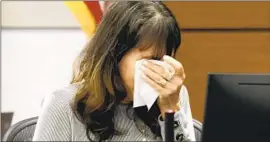  ?? MIKE STOCKER Pool Photo ?? IVY SCHAMIS wipes her tears while testifying in the penalty trial of the Parkland killer in Fort Lauderdale, Fla. Two students in her class died in the rampage.