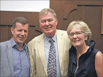  ??  ?? Jim Gallagher, managing director of Scottish Sea Farms, with newly retired Geoff Kidd and his wife Jane.