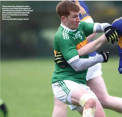  ?? Photo by Michelle Cooper Galvin ?? Shane Courtney, Glenflesk under pressure from Alan O’Donoghue of John Mitchels in the Kerry Petroleum Intermedia­te Club Championsh­ip Round 3 at Glenflesk on Sunday afternoon