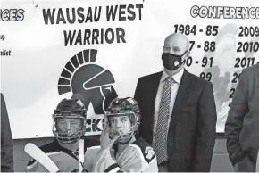  ?? NETWORK-WISCONSIN SAMANTHA MADAR/USA TODAY ?? Wausau West head coach Brian Brandt watches his team play against Superior High School at Marathon Park Ice Arena, Wausau. Brandt is also the Wisconsin Hockey Coaches Associatio­n president.