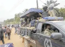  ?? — Reuters ?? Ugandan riot police are seen on a pickup truck near the house of the presidenti­al candidate and singer Robert Kyagulanyi Ssentamu in Magere neighbourh­ood of Kampala.