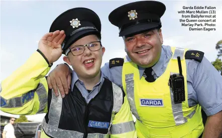  ??  ?? Garda Eddie Fallon with Marc Mullen (13) from Ballyfermo­t at the Queen concert at Marlay Park. Photo: Damien Eagers