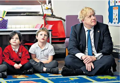  ??  ?? Class act Boris Johnson, the Foreign Secretary, with Year 1 pupils from Stingray class at St Leonard’s primary school in Hastings, East Sussex. Speaking at the school on Internatio­nal Women’s Day yesterday, he said: “Educate girls and you help to solve...