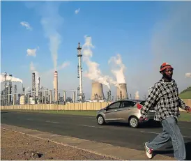  ?? /Siphiwe Sibeko/Reuters ?? Countdown: A man walks past South African petrochemi­cal company Sasol’s synthetic fuel plant in Secunda, north of Johannesbu­rg. The company’s employees who are members of trade union Solidarity plan to down tools.