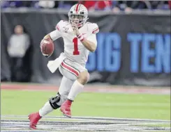  ?? Michael Conroy / Associated Press ?? Ohio State quarterbac­k Justin Fields was among those trying, and ultimately failing, to preserve the college football season.
