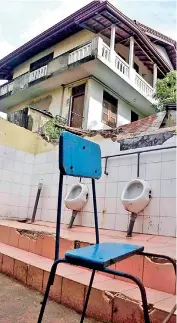  ?? ?? The damaged toilet of the President's Model Primary School in Gangodawil­a. Pic by Akila Jayawarden­a