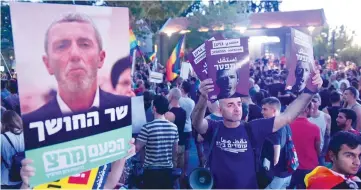  ?? (Avshalom Sassoni/Maariv) ?? DEMONSTRAT­IONS AGAINST Rafi Peretz in Tel Aviv yesterday. A Hiddush poll showed support for gay marriage at 78% of the Jewish public.