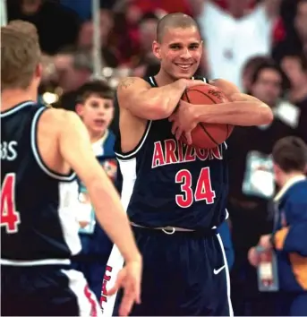  ?? AP PHOTOS ?? ABOVE: Miles Simon clutches the game ball while celebratin­g Arizona’s overtime victory against Kentucky in the NCAA title game in 1997. LEFT: North Carolina coach Roy Williams yells to his team during a Final Four game against Kansas in 2008.